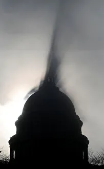 Early morning fog creates a shadow of the U. S. Capitol dome in Washington