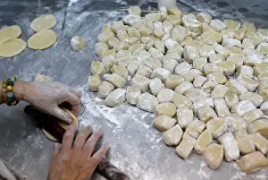 Hongkong Prints: An employee makes mooncakes with anti-extradition bill slogans at Wah Yee Tang Bakery in
