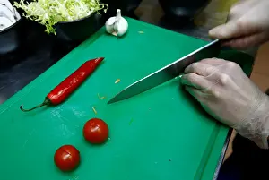 Food Prints: Employee prepares a salad in vegetarian restaurant Green Cuisine in Minsk