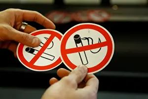 Austria Prints: An employee shows no smoking signs in the Karas printing shop in Vienna