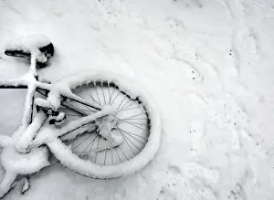Weather Prints: A fallen bicycle lies in the snow in Cambridge in eastern England