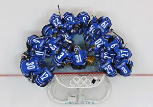 Finlands players gather during a pregame ritual before their womens ice hockey play-offs