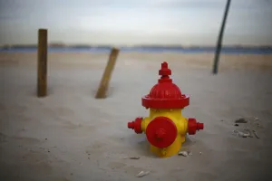 A fire hydrant is seen buried in the sand in the Breezy Point neighborhood of Queens A fire hydrant is seen buried in the sand in the Breezy Point neighborhood of Queens