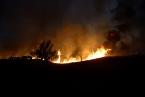 Images Dated 18th April 2018: Firefighters struggle to fight the Rhea fire into the night near Seiling