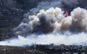 Greece Prints: A firefighting helicopter drops water on a raging wildfire at the Kareas suburb