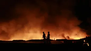 India Prints: Firemen try to extinguish a fire that broke out in a rubber warehouse at Agartala