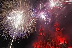 Fireworks explode over an ancient cathedral in Santiago de Compostela during celebrations