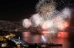 New Year Prints: Fireworks explode during a pyrotechnic show to celebrate the new year in the coastal city