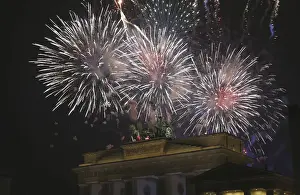 Celebration Prints: Fireworks explode next to the Quadriga sculpture atop the Brandenburg gate during