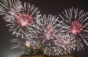 Fireworks explode next to the Quadriga sculpture atop the Brandenburg gate during
