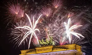 New Year Prints: Fireworks explode over the Quadriga sculpture atop the Brandenburg gate during New Year
