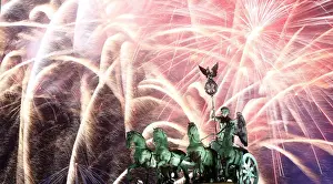 New Year Prints: Fireworks explode over the Quadriga sculpture atop the Brandenburg gate during New Year