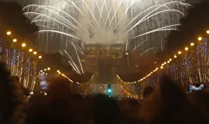 Fireworks light the sky over the Arc de Triomphe on the Champs Elysees Avenue in Paris as Fireworks light the sky over the Arc de Triomphe on the Champs Elysees Avenue in Paris as