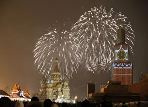 Fireworks light the sky over St. Basils Cathedral and Kremlins Spasskaya Tower