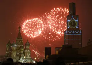 Images Dated 2014 December: Fireworks light the sky over St. Basils Cathedral and Kremlins Spasskaya Tower