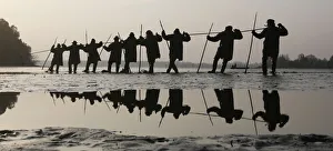 Fishermen pull a net containing fish from a lake at the village of Bosilec during Fishermen pull a net containing fish from a lake at the village of Bosilec during