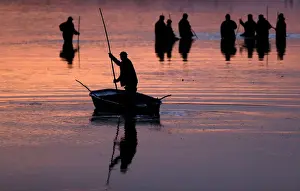 Fishermen set out to begin the traditional carp haul near the town of Trebon