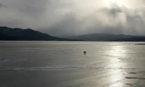 Fishermen walk along the frozen Yenisei River in the Taiga district outside Russia s