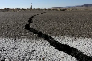 California Prints: Fissures that opened up under a highway during a powerful earthquake that struck Southern