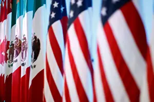 Flags of Canada, Mexico and the U. S. are seen before a joint news conference on