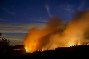 Wildfire Prints: Flames and smoke from the King Fire fill the sky above Fresh Pond