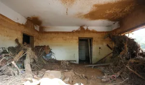 Leone Prints: Flood level marks are seen on the wall inside a room filled with muds