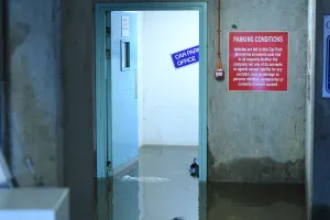 Storm Prints: Flood water is seen at a doorway in a multi-storey car park as flood waters reached up to