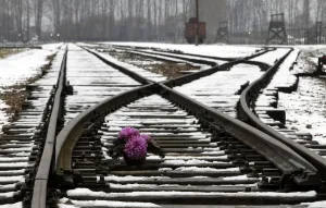Poland Prints: Flowers for the victims of the former Nazi death camp of Auschwitz are seen on a railway