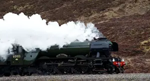 The Flying Scotsman steam train travels north through the Drumochter Pass, Scotland