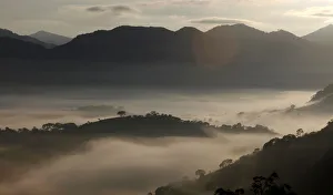 Prints of Fog sourrounds the mountains in Goncalves, in the state of Minas Gerais in southwestern Brazil, April 18, 2014. REUTERS/Paulo Whitaker (BRAZIL - Tags: ENVIRONMENT) - GM1EA4I1O9G01 Brazil Prints: Fog sourrounds the mountains in Goncalves, in the state of Minas Gerais