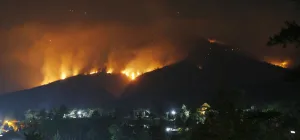 Indonesia Prints: Forest fires on the Arjuna and Welirang mountains are seen from the Pecalukan village of
