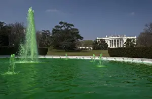 Images Dated 2012 March: The fountain on the South Lawn of the White House flows with water dyed green for St