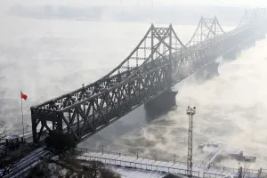 Prints of The Friendship Bridge, which connects the Chinese city of Dandong with Sinuiju in North Korea, is seen amid heavy fog over the Yalu River, in Dandong, Liaoning province December 16, 2010 China Prints: The Friendship Bridge, which connects the Chinese city of Dandong with Sinuiju in North