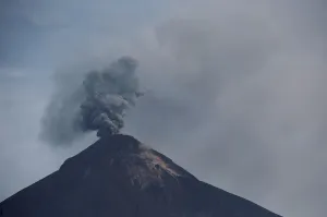Guatemala Prints: The Fuego volcano spews smoke and ash, as seen from San Miguel Los Lotes in Escuintla