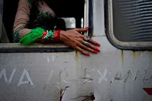 Cuba Prints: A gay rights activist sits in a bus during the 11th annual March against Homophobia