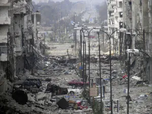 Images Dated 2014 March: A general view of a deserted and damaged street filled with debris in Homs