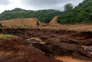Kenya Prints: A general view shows the dam that burst its walls, overrunning nearby homes