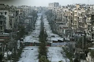 A general view shows a damaged street with sandbags used as barriers in Aleppos Saif