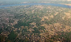 A general view shows the Nile River, houses and agricultural land seen from the window of