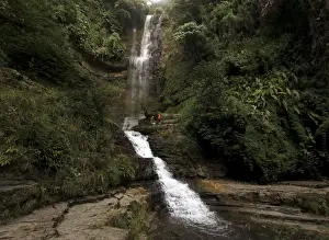 A general view of a waterfall at the Juan Curi natural park near the municipality