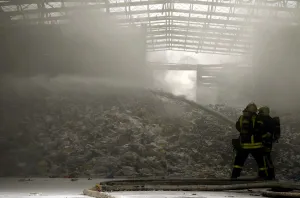 Prints of German firefighters use foam cannons to extinguish a fire in an interim storage facility for recycling garbage, in the harbour of Hanau, 30km (19 miles) south of Frankfurt, March 19, 2010 Germany Prints: German firefighters using foam cannons to extinguish a fire in an interim storage