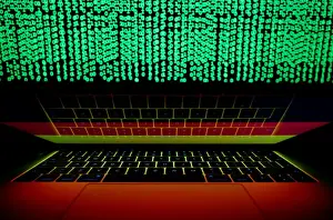 Cyber Prints: German flag is seen on the laptop screen in front of a computer screen on which cyber