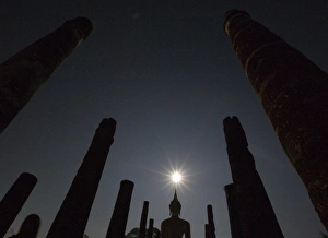 <b class=qtipBold><figcaption>GF2E4BC1ALC01</figcaption></b><br>A Buddha statue in Wat Mahathat is silhouetted by a full moon during the annual Loy Krathong festival in Thailand's Sukhothai Province on November 12, 2008. The Thai tradition of Loy Krathong started off in the ancient capital of Sukhothai and is now celebrated throughout Thailand. Festival goers release decorated banana-leaf krathongs onto ponds, lakes and rivers on the full moon of the 12th month in the traditional Thai lunar calendar, honoring the Goddess of Water. REUTERS/Adrees Latif (THAILAND) GF2E4BC1ALC01
