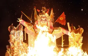 Malaysia Prints: A giant paper statue of Chinese deity Da Shi Ye is burnt during the Chinese Hungry Ghost