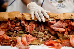 A part of a giant Torta weighing 820 kg and 67-meters long is pictured