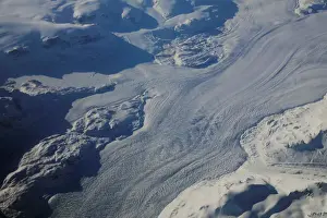 : A glacier is seen making a path through mountains on the eastern coast of Greenland