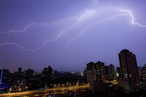 Prints of Flashes of lighting illuminate the sky during a thunderstorm over Shanghai July 12, 2009. REUTERS/Aly Song (CHINA ENVIRONMENT IMAGES OF THE DAY) China Prints: GM1E57C1NIV01