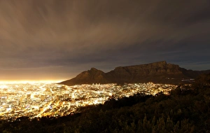 <b class=qtipBold><figcaption>GM1E5B30KJ201</figcaption></b><br>Cape Town lights up as dusk falls over the city's backdrop Table Mountain, November 2, 2009. Cape Town is one of nine South African cities hosting the 2010 Fifa Soccer World Cup. REUTERS/Mike Hutchings (SOUTH AFRICA SPORT SOCCER IMAGES OF THE DAY) GM1E5B30KJ201