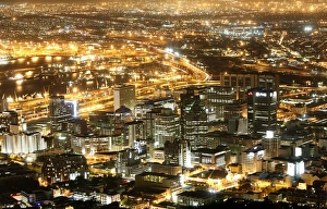 <b class=qtipBold><figcaption>GM1E5B30KOT01</figcaption></b><br>Cape Town's business district lights up as dusk falls over the city, November 2, 2009. Cape Town is one of nine South African cities hosting the 2010 Fifa Soccer World Cup. REUTERS/Mike Hutchings (SOUTH AFRICA SPORT SOCCER) GM1E5B30KOT01