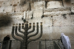 Prints of Jewish worshippers take part in morning prayers near a Hanukkah Menorah at the Western Wall, Judaisms holiest prayer site, in Jerusalems Old City December 17, 2009 Israel Prints: GM1E5CH1PCZ01